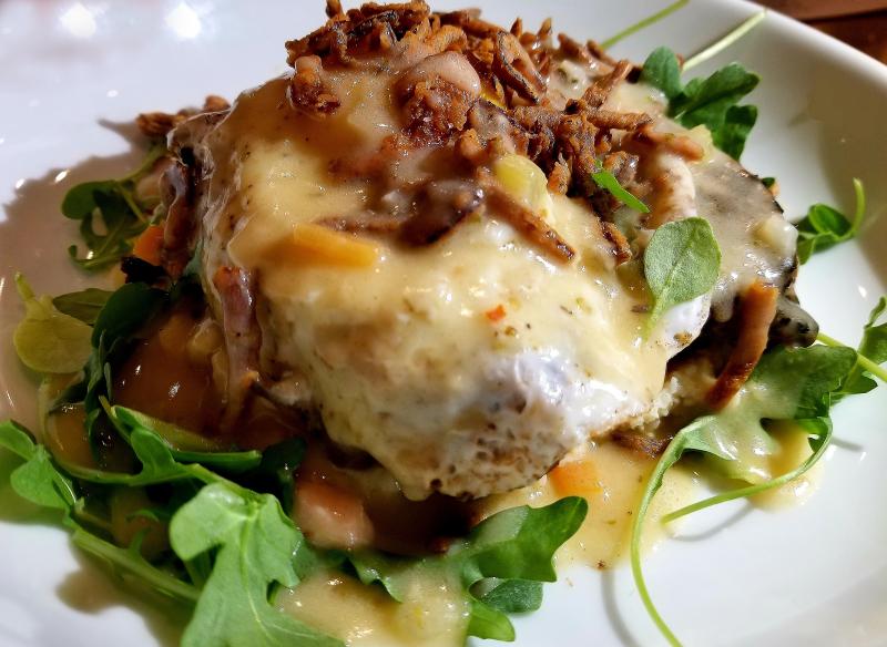Comfort food reigns on Baltimore Avenue Thursday nights at The Pines, when the humble meatloaf takes center stage. Chef Dane's version rests proudly on a bed of cheddar grits, drizzled with brown gravy and crowned with a jaunty fried egg. Dinner doesn't get much more comfortable than this. BOB YESBEK PHOTO